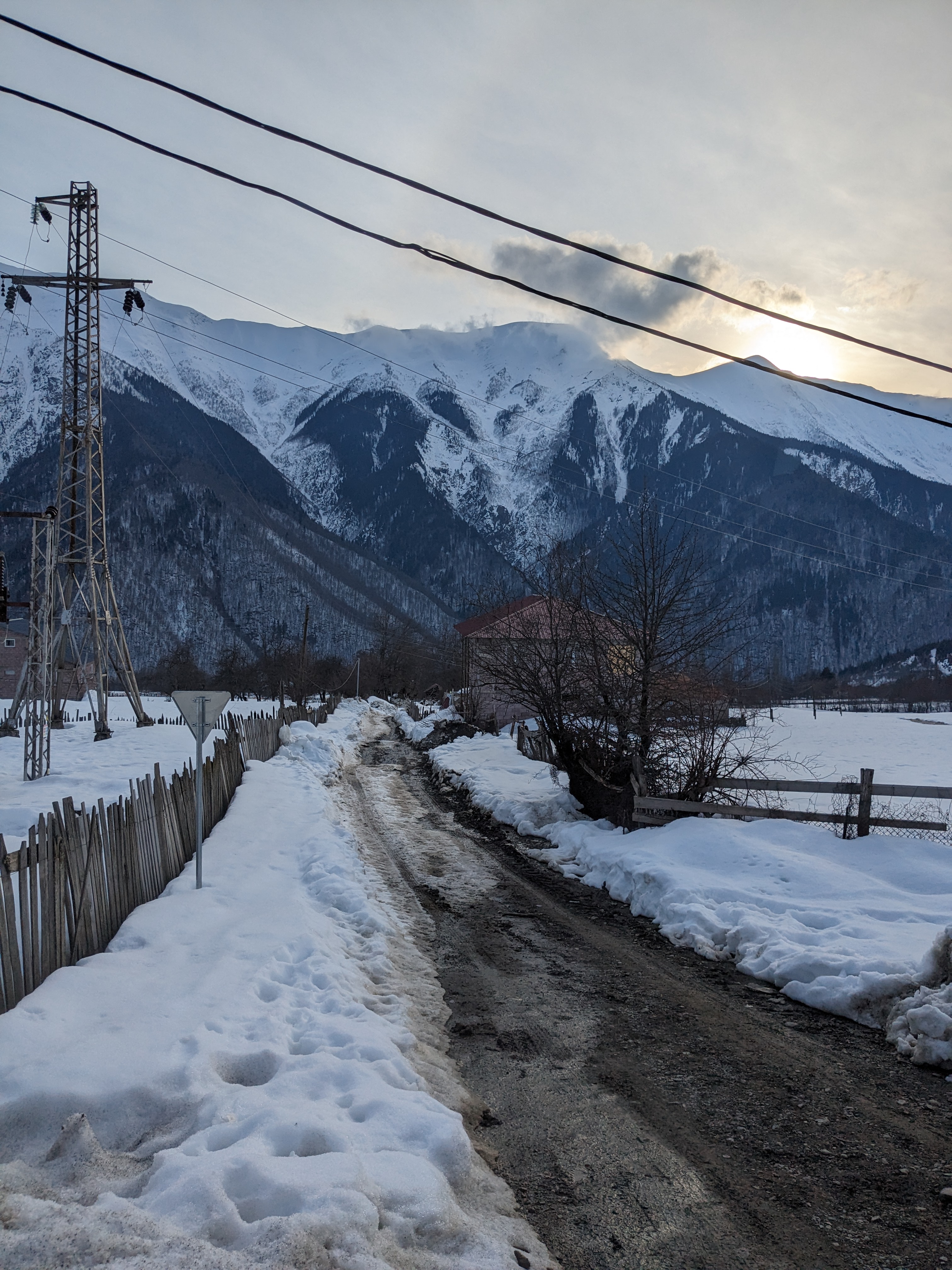 view of a road with mountains in the backgrond